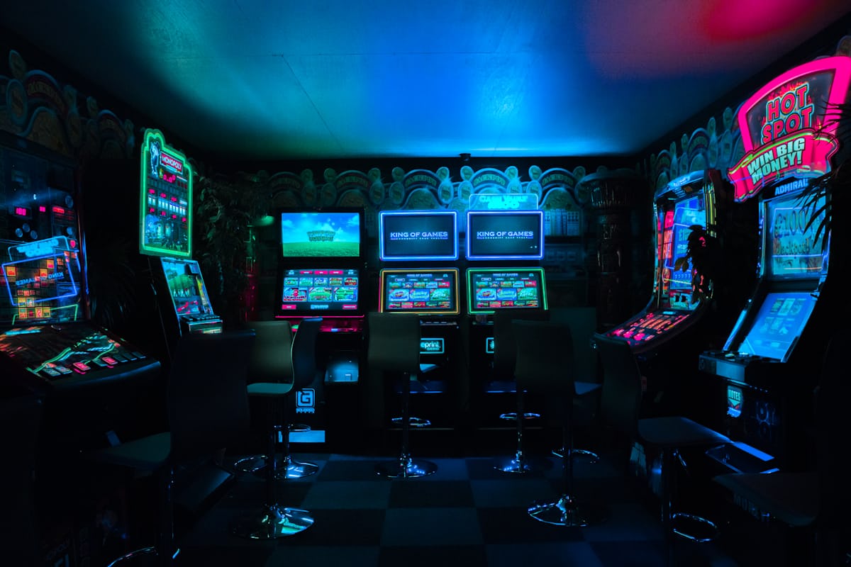 Players at gaming computers in a dim studio